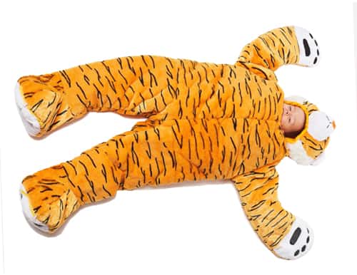 child laying down in tiger sleep sack by snoozzoo