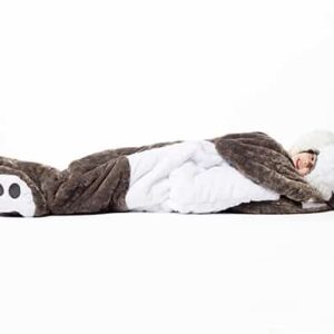 child laying down in wolf sleeping bag