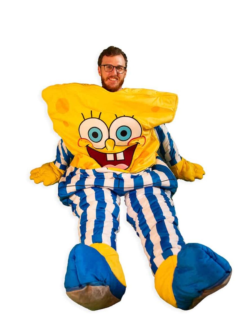 adult sitting in spongebob squarepants sleepsack