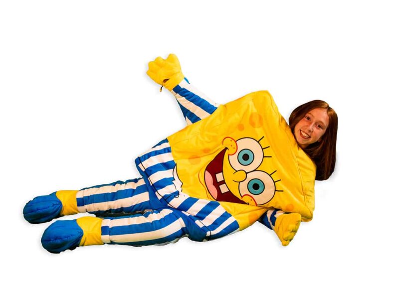 child laying down in spongebob squarepants sleeping bag