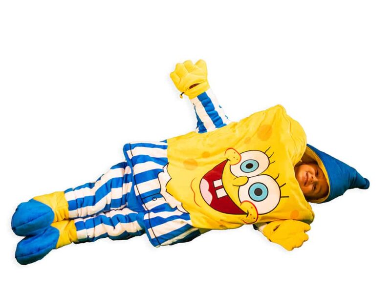 child laying down in spongebob squarepants sleepsack